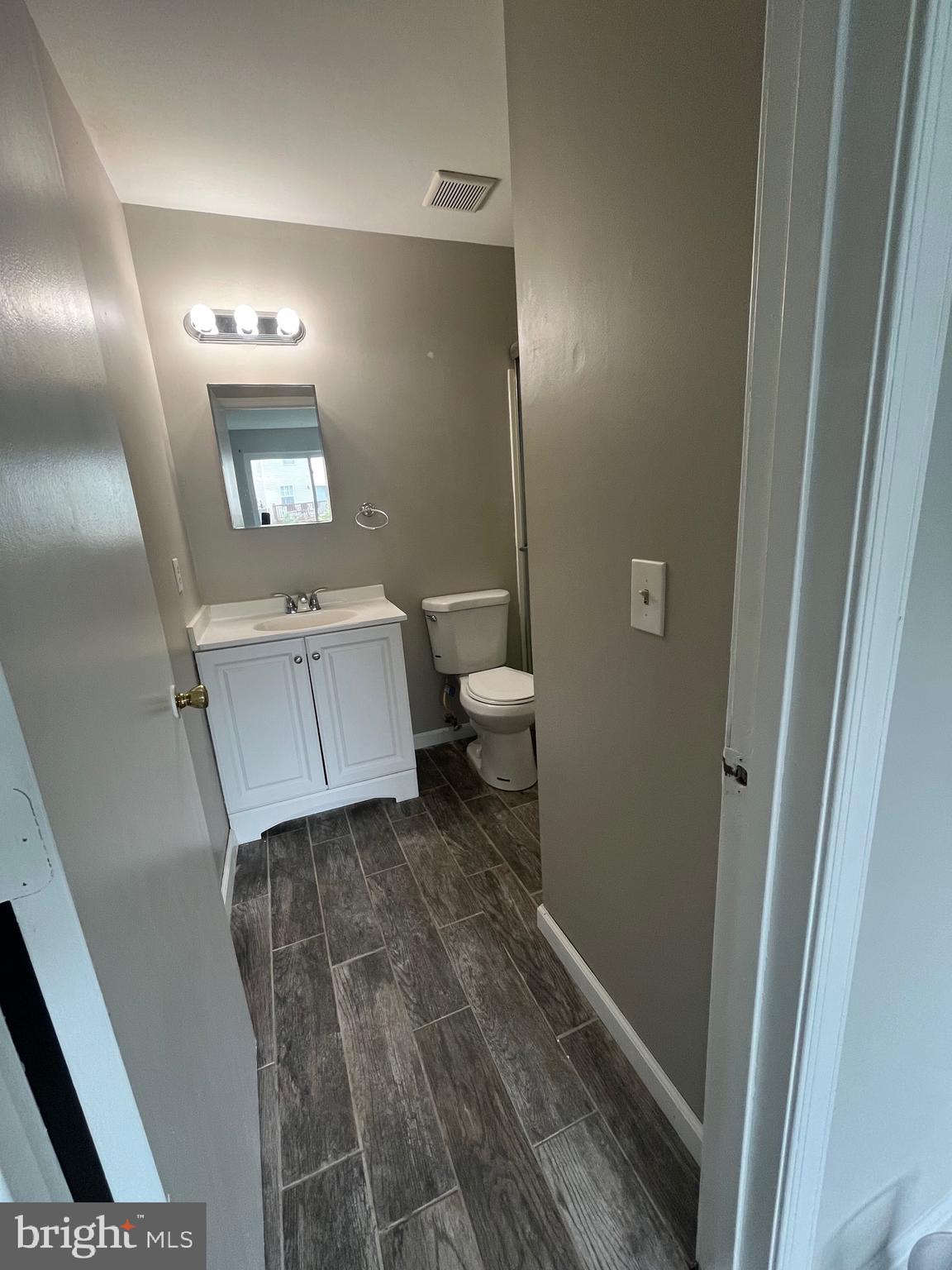 815 Woodchip Road Lumberton, NJ 08048 - Photo 16 of 32 a bathroom with a sink and mirror