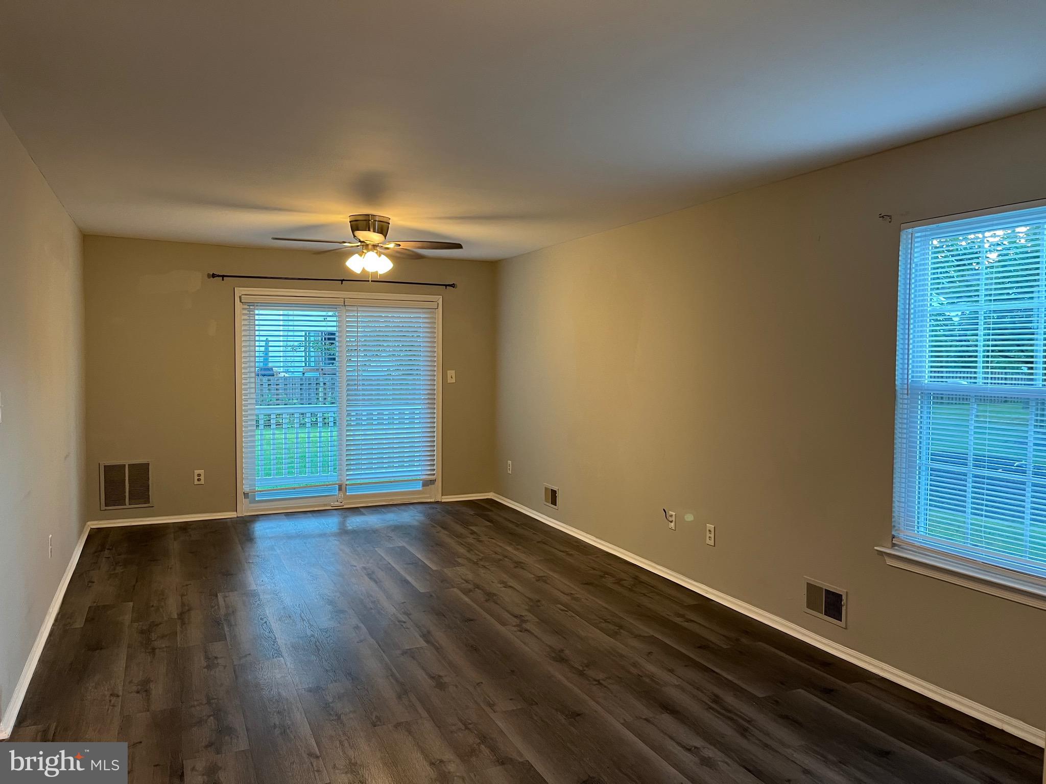 815 Woodchip Road Lumberton, NJ 08048 - Photo 21 of 32 an empty room with wooden floor cabinet and windows