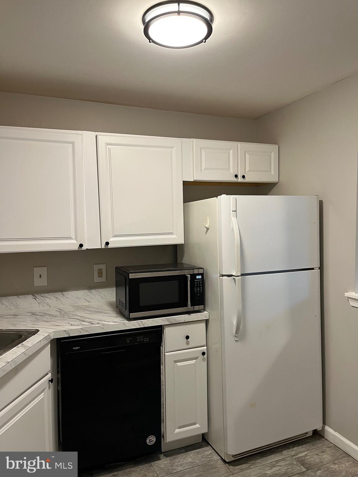 815 Woodchip Road Lumberton, NJ 08048 - Photo 24 of 32 a kitchen with a refrigerator sink and cabinets