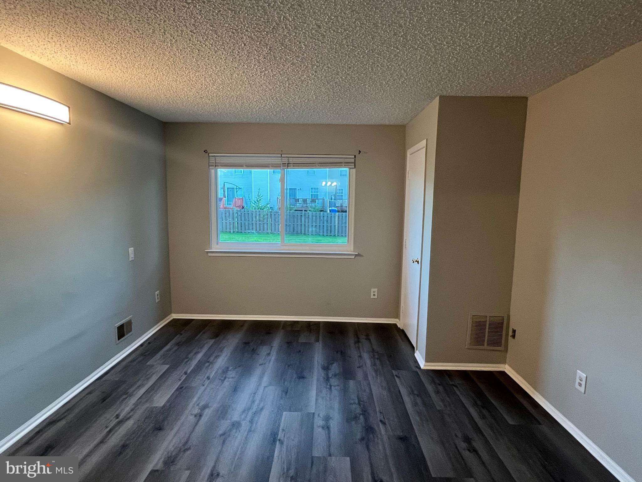 815 Woodchip Road Lumberton, NJ 08048 - Photo 25 of 32 an empty room with wooden floor and windows