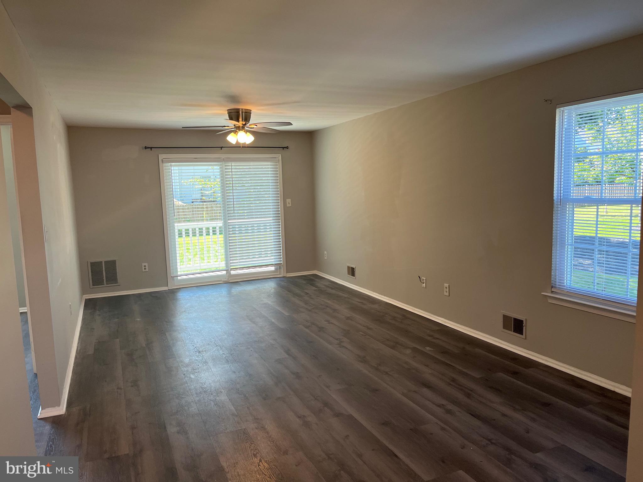 815 Woodchip Road Lumberton, NJ 08048 - Photo 9 of 32 an empty room with wooden floor and windows