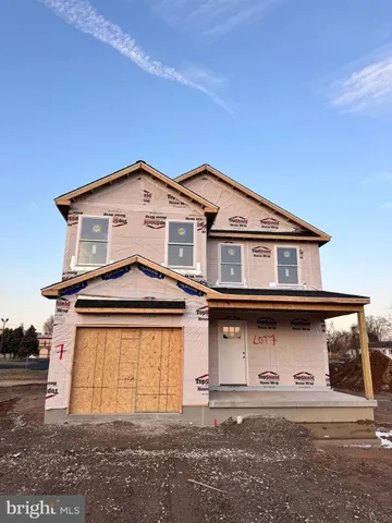 a front view of a house with a garage