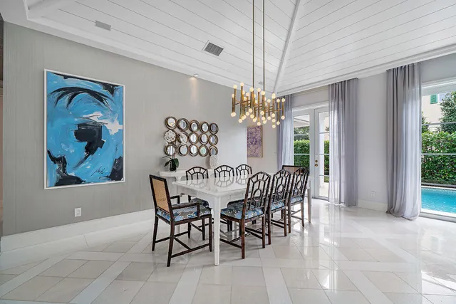 a kitchen with stainless steel appliances granite countertop a sink a stove a window and cabinets