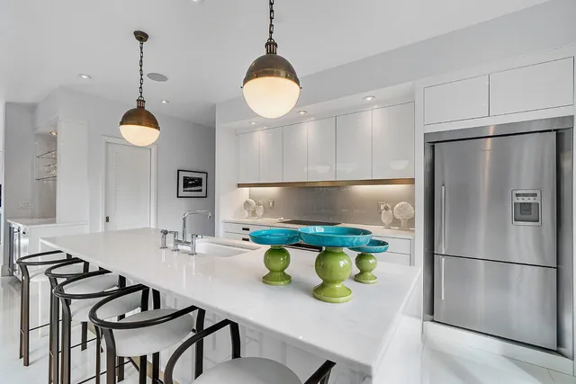 a kitchen with a sink cabinets and window