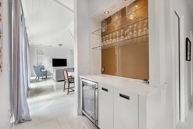 a patio with yard glass top table and chairs