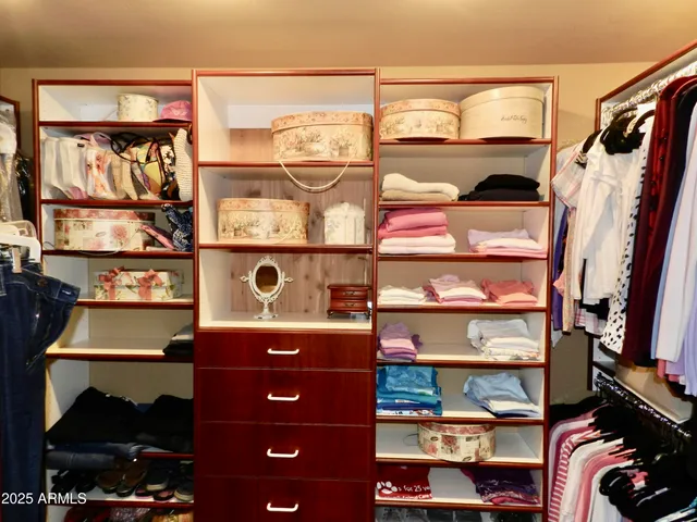 a room with furniture and two windows