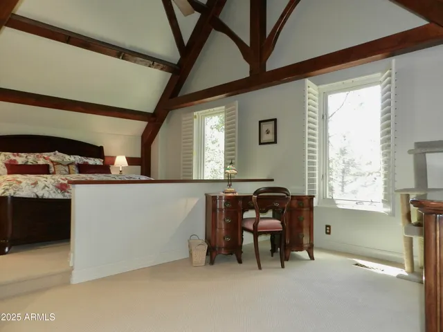 a wooden bench sitting in the middle of a yard