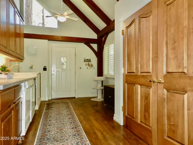 a view of a patio with table and chairs and potted plants