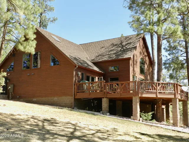 a view of a house with a snow on the road