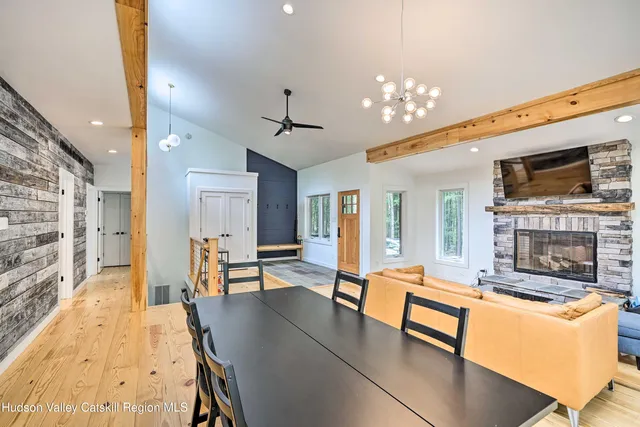 a bedroom with a bed and a mirror