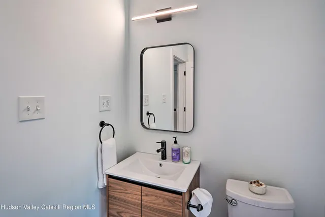 a view of a livingroom with furniture and staircase