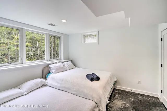 a bathroom with a bathtub a toilet and a shower