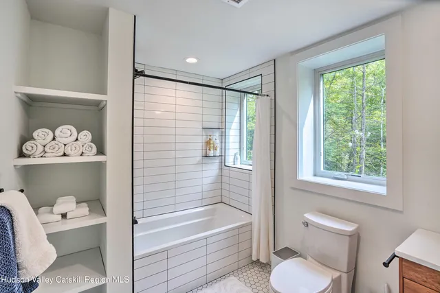 a bathroom with a sink toilet and vanity