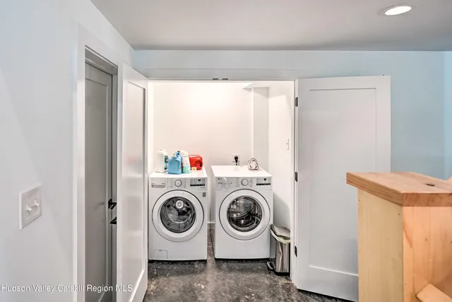 a balcony with wooden floor and furniture