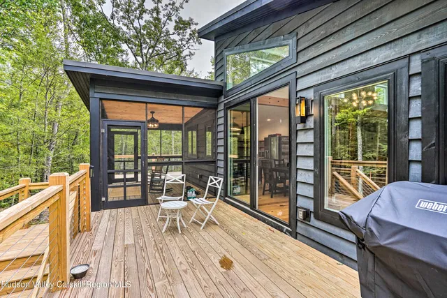 a balcony view with a seating space