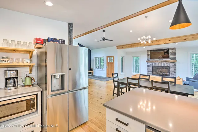 a living room with fireplace furniture and a flat screen tv