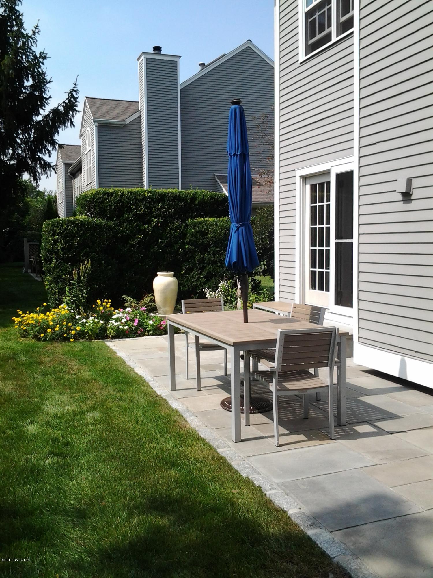 28 Home Place, Unit B2 Greenwich, CT 06830 - Photo 14 of 15 a view of a house with backyard and sitting area