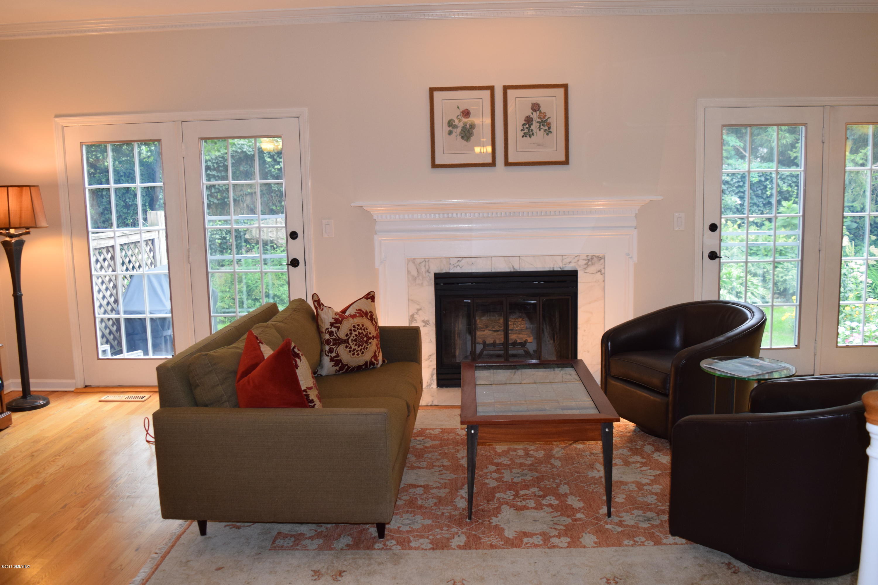 28 Home Place, Unit B2 Greenwich, CT 06830 - Photo 2 of 15 a living room with furniture and a fireplace
