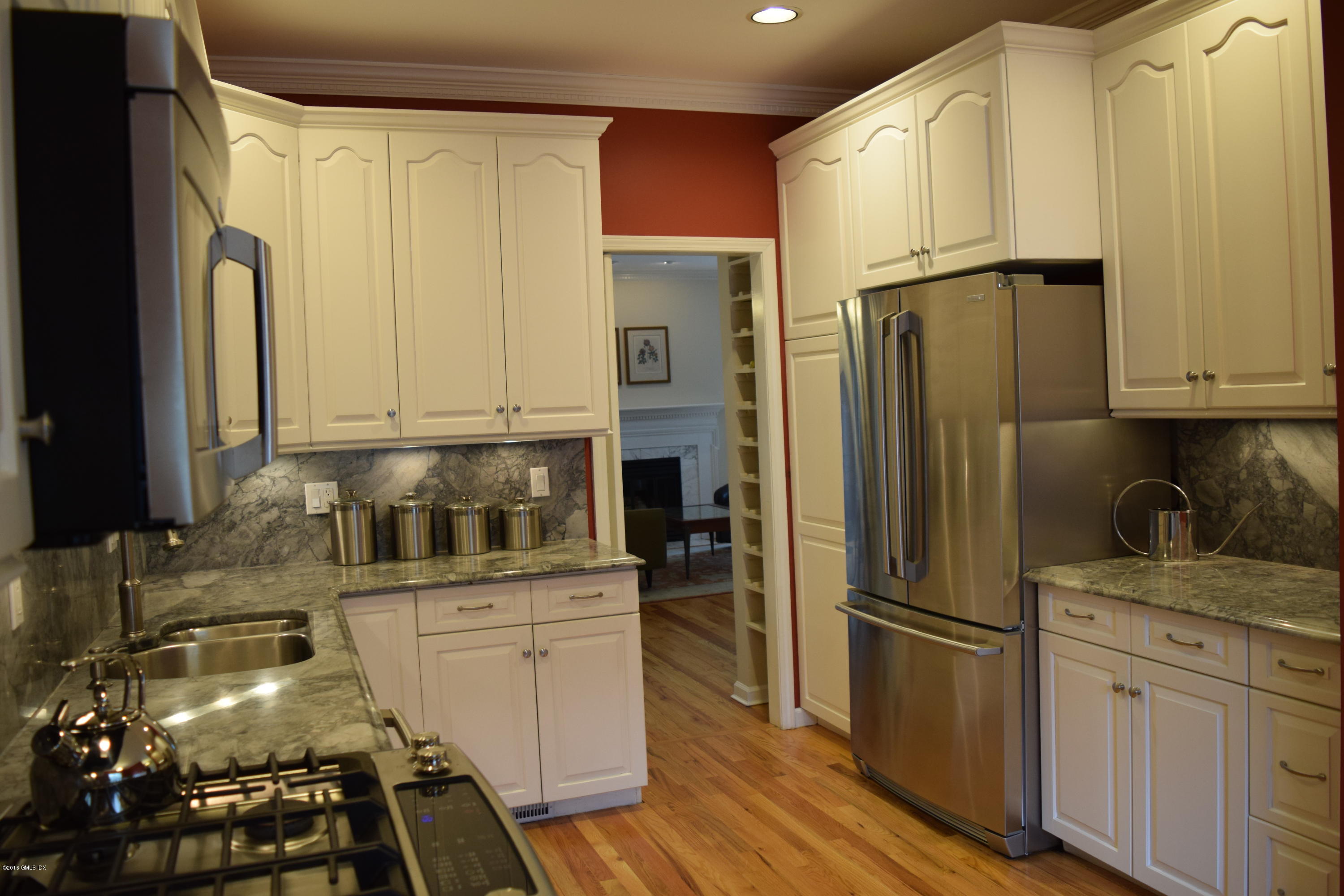28 Home Place, Unit B2 Greenwich, CT 06830 - Photo 6 of 15 a kitchen with a refrigerator sink and stove
