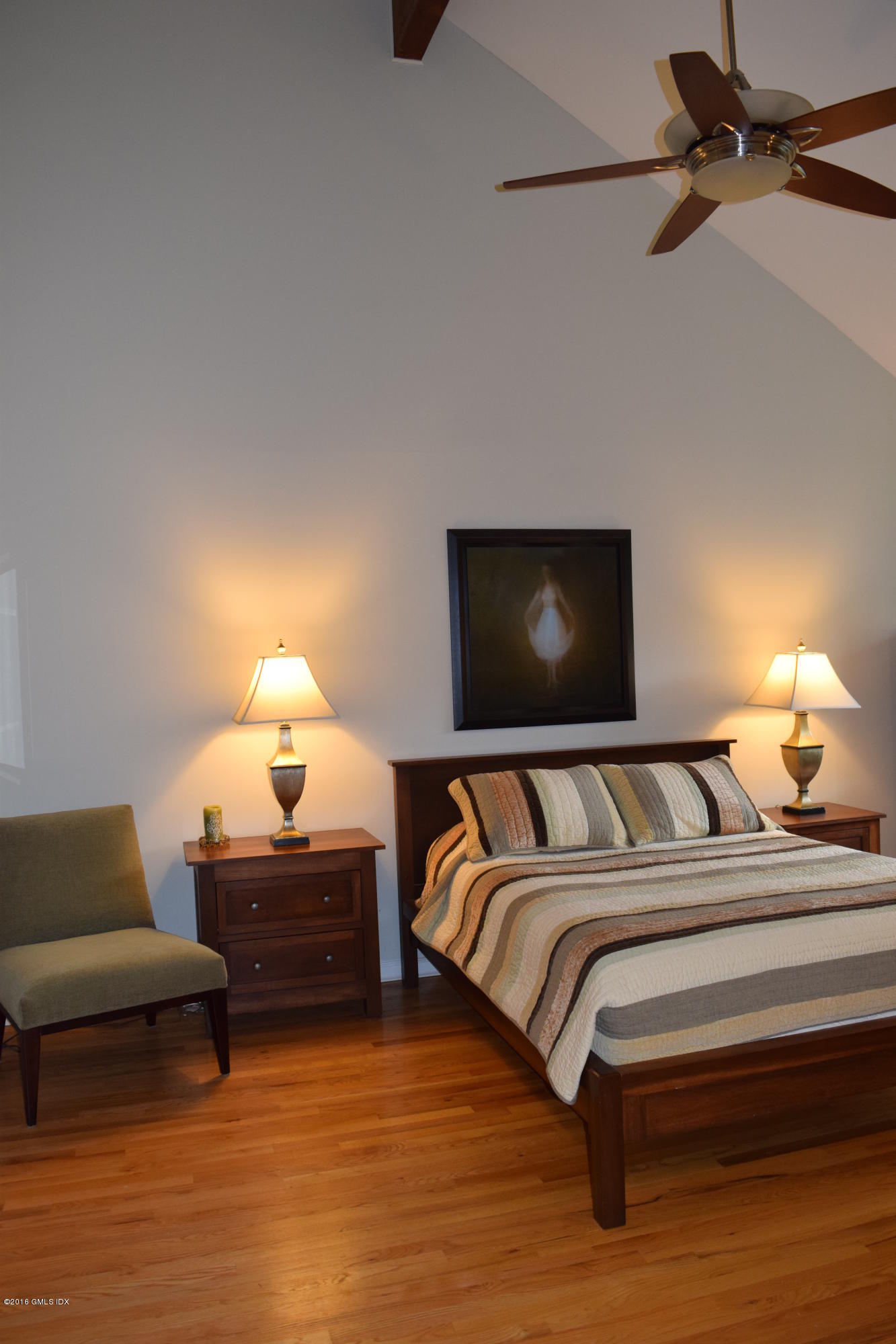 28 Home Place, Unit B2 Greenwich, CT 06830 - Photo 8 of 15 a bedroom with bed and a lamp with window
