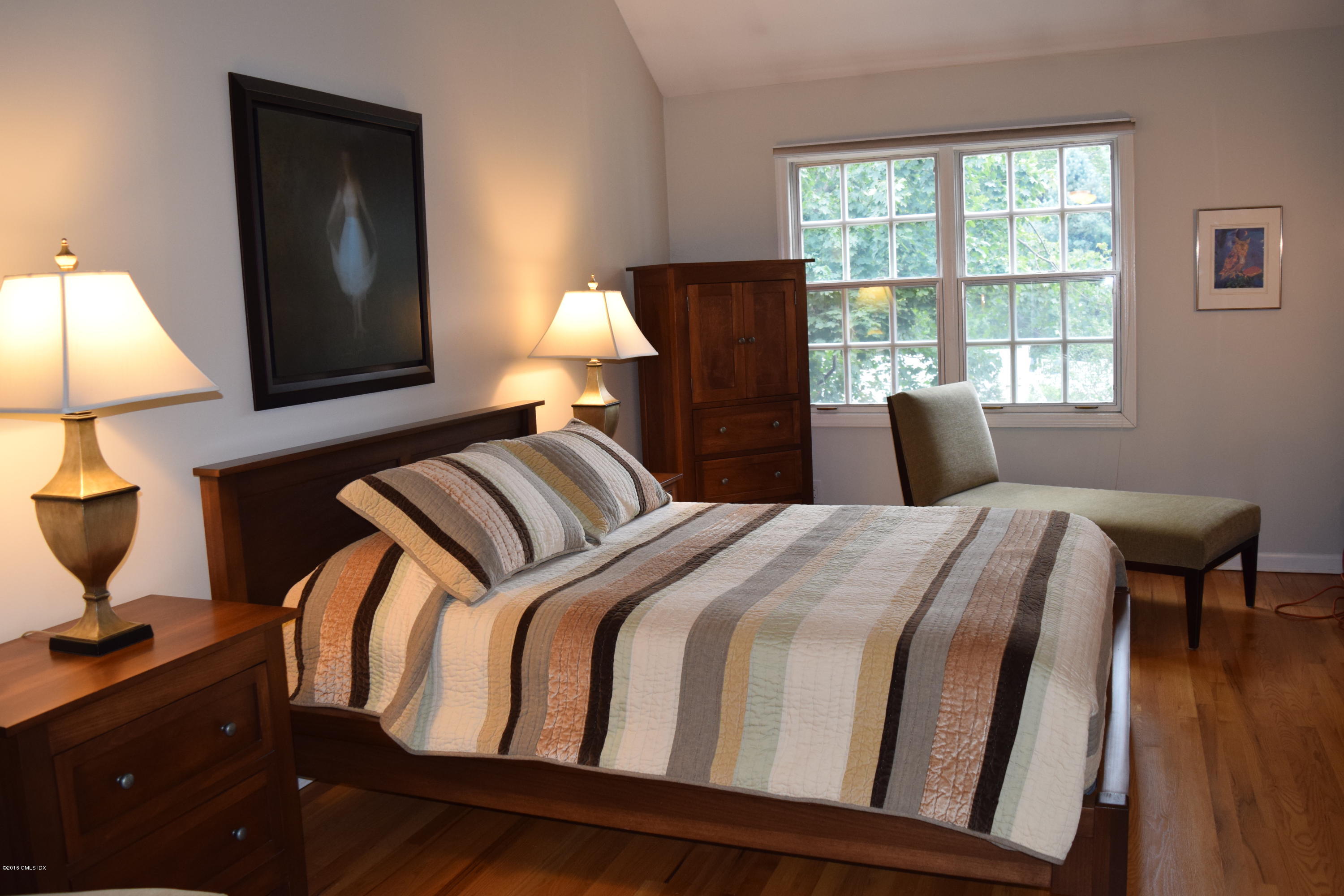 28 Home Place, Unit B2 Greenwich, CT 06830 - Photo 9 of 15 a bedroom with a bed and wooden floor
