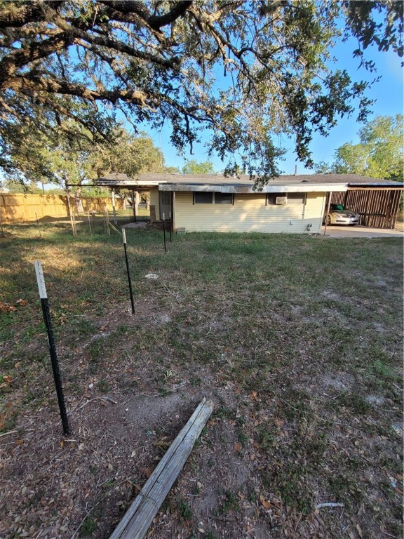 a view of a yard with a tree