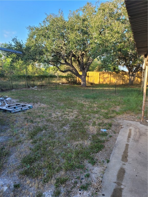 125 Harbor Circle Mathis, TX 78368 - Photo 4 of 12 a view of a yard with a tree