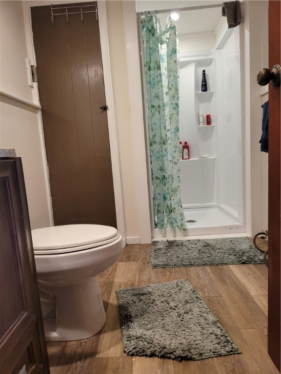 125 Harbor Circle Mathis, TX 78368 - Photo 9 of 12 a white toilet sitting next to a shower