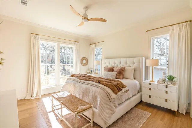 a bed room with a bed and a large window