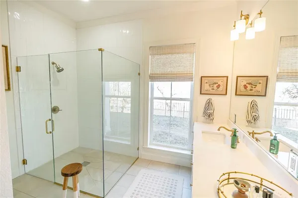 a bathroom with a tub and shower