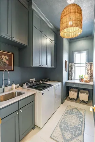 a kitchen with a sink cabinets and window