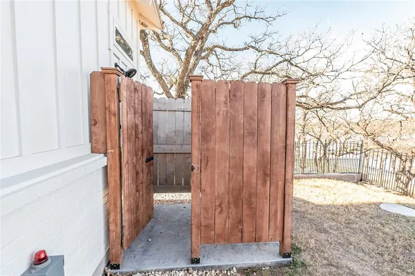 a bathroom with a toilet sink and shower