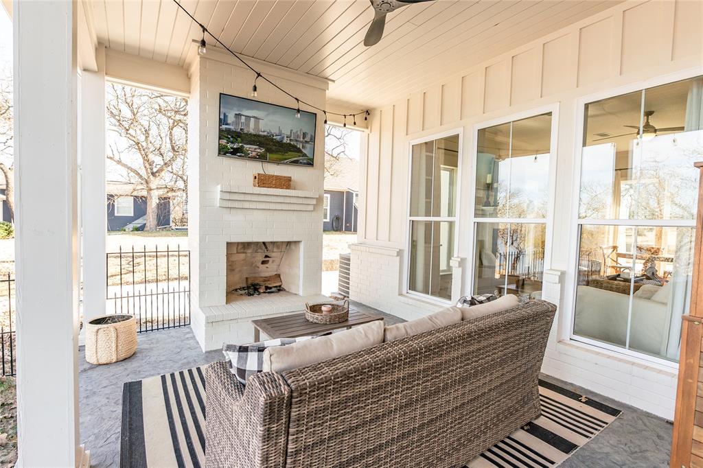 1061 Tradewinds Road Nocona, TX 76255 - Photo 33 of 40 a living room with fireplace furniture and a large window