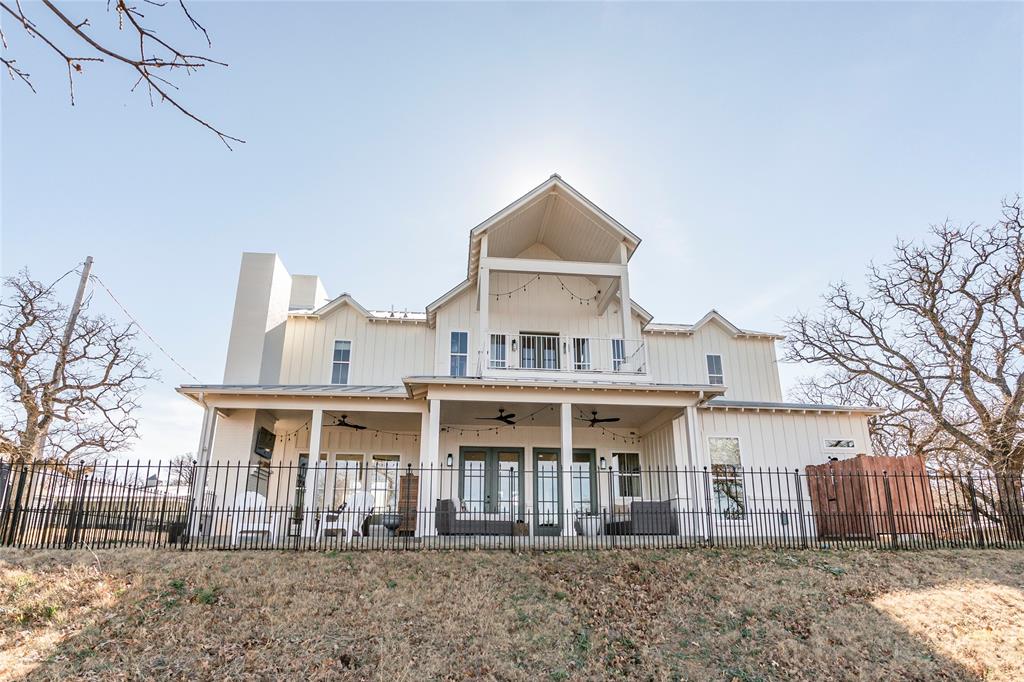 1061 Tradewinds Road Nocona, TX 76255 - Photo 37 of 40 a front view of a house with a porch