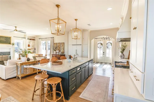 a large kitchen with a table and chairs