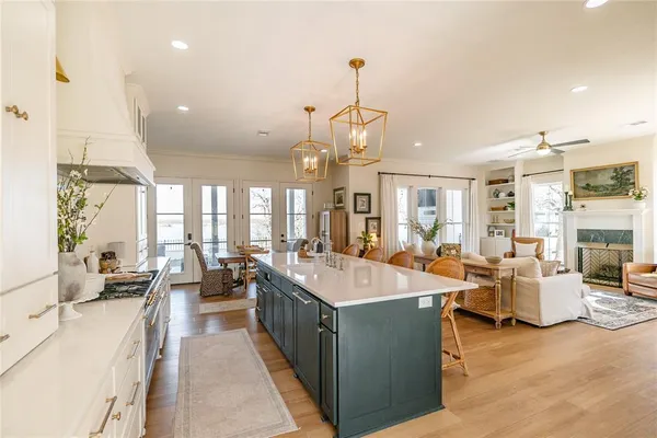 a large kitchen with lots of counter space and windows