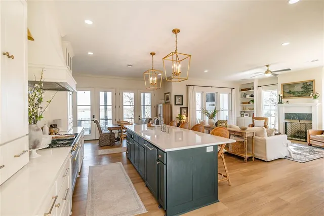 a large kitchen with lots of counter space and windows