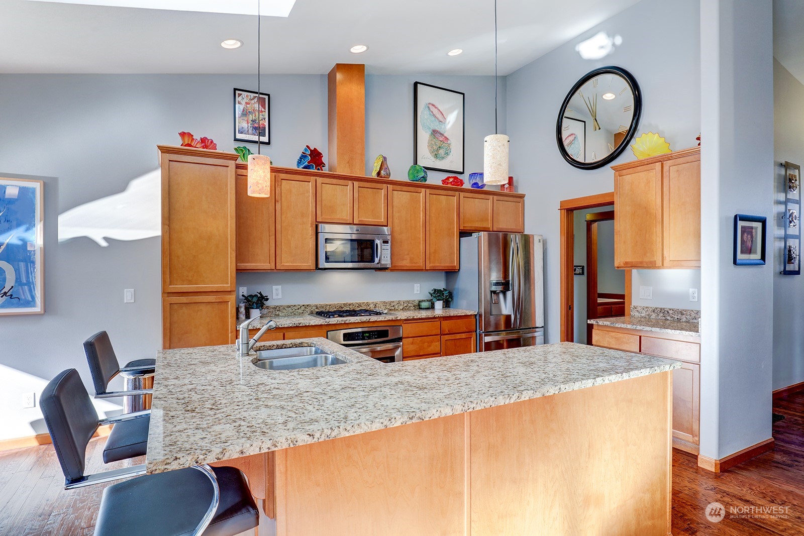 4202 157th Place Southeast Bothell, WA 98012 - Photo 11 of 24 a kitchen with stainless steel appliances granite countertop a stove and a sink with granite countertops