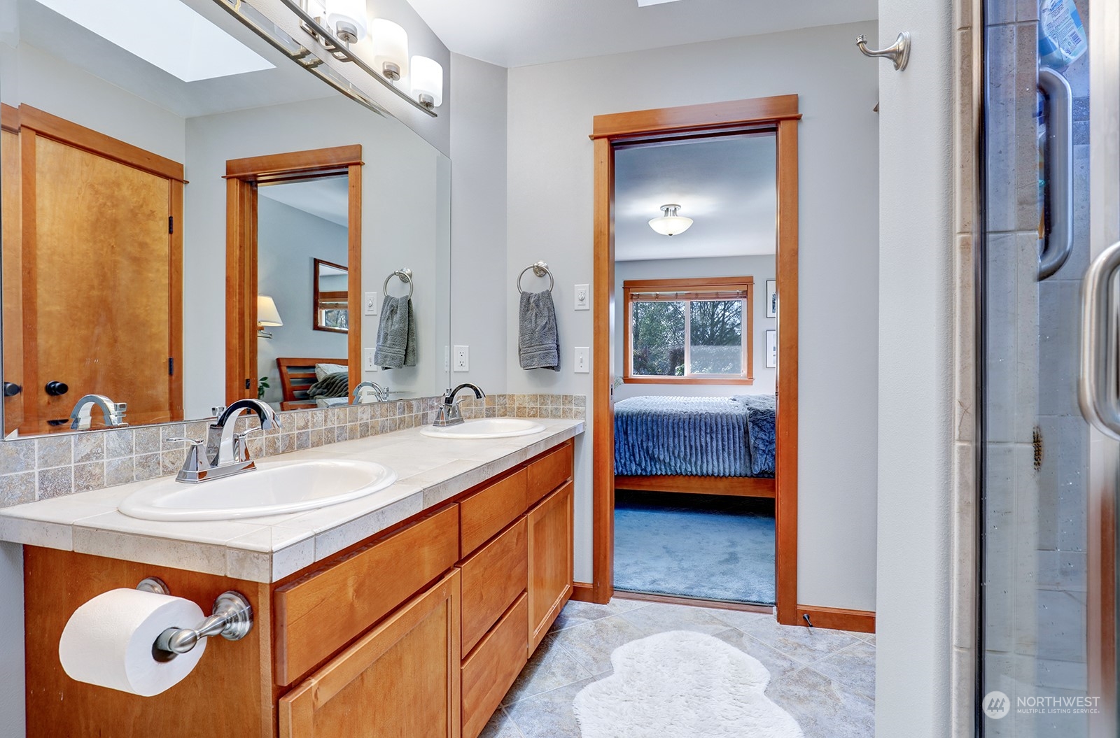 4202 157th Place Southeast Bothell, WA 98012 - Photo 18 of 24 a bathroom with a sink a vanity and a mirror