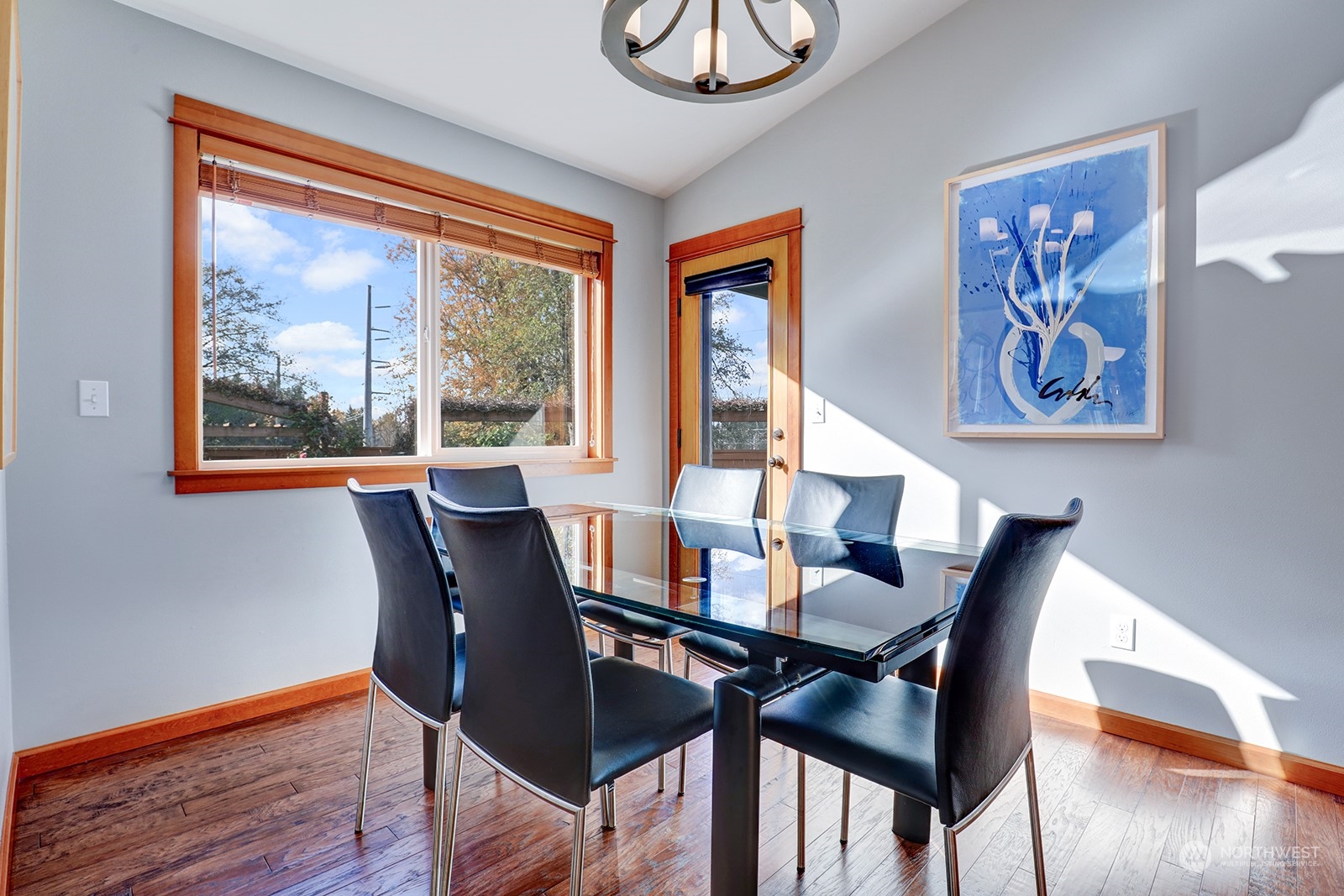 4202 157th Place Southeast Bothell, WA 98012 - Photo 8 of 24 a view of a dining room with furniture window and wooden floor