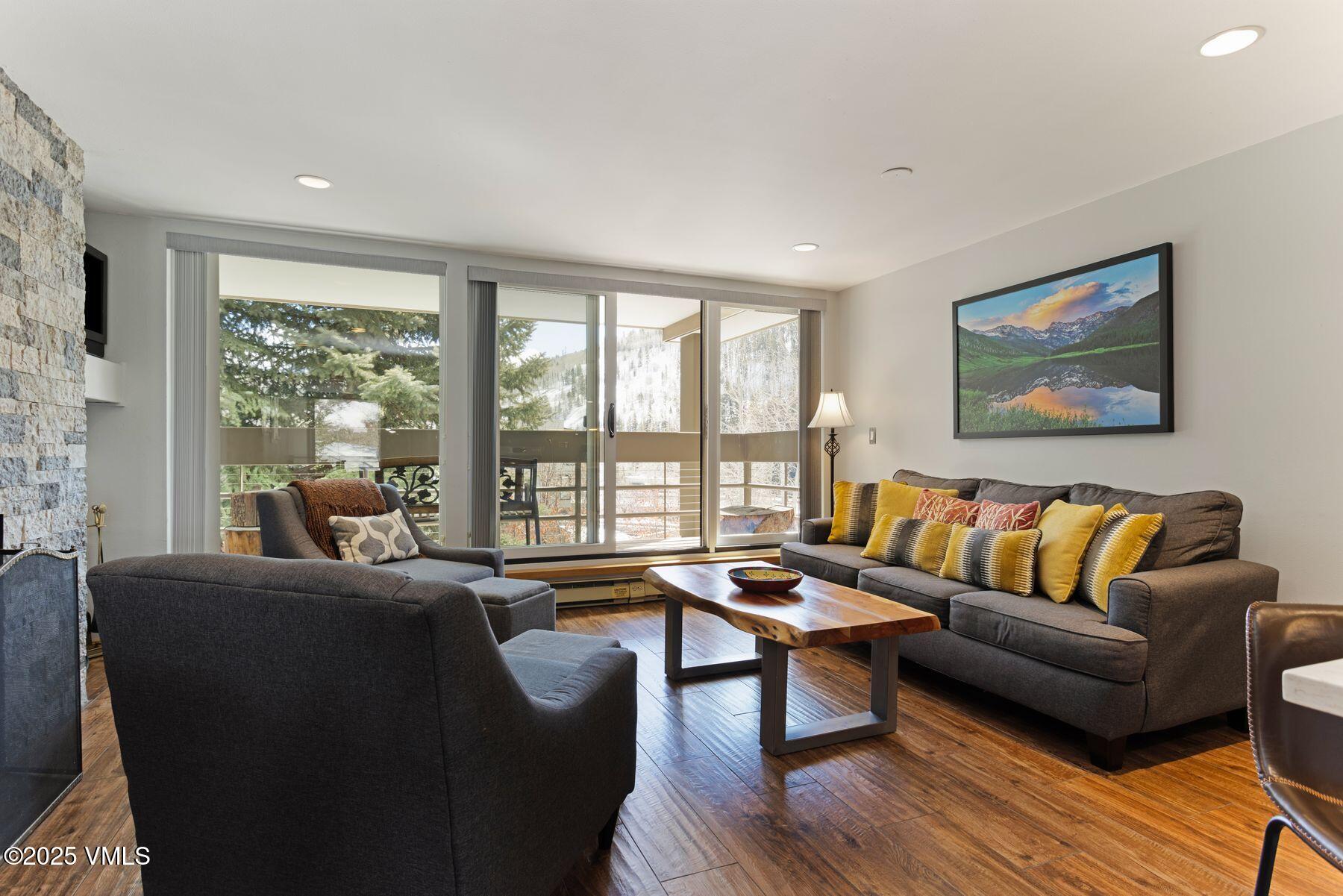 1100 North Frontage Road West, Unit 2311 Vail, CO 81657 - Photo 2 of 34 a living room with furniture and a large window
