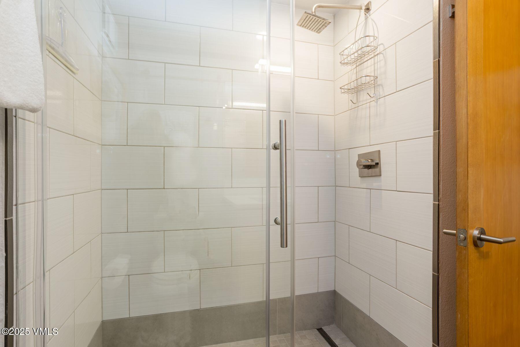 1100 North Frontage Road West, Unit 2311 Vail, CO 81657 - Photo 21 of 34 a bathroom with a shower