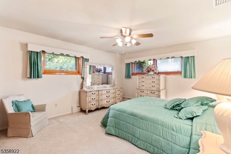 35 Hillside Avenue Netcong, NJ 07857 - Photo 18 of 41 a bedroom with a bed and ceiling fan