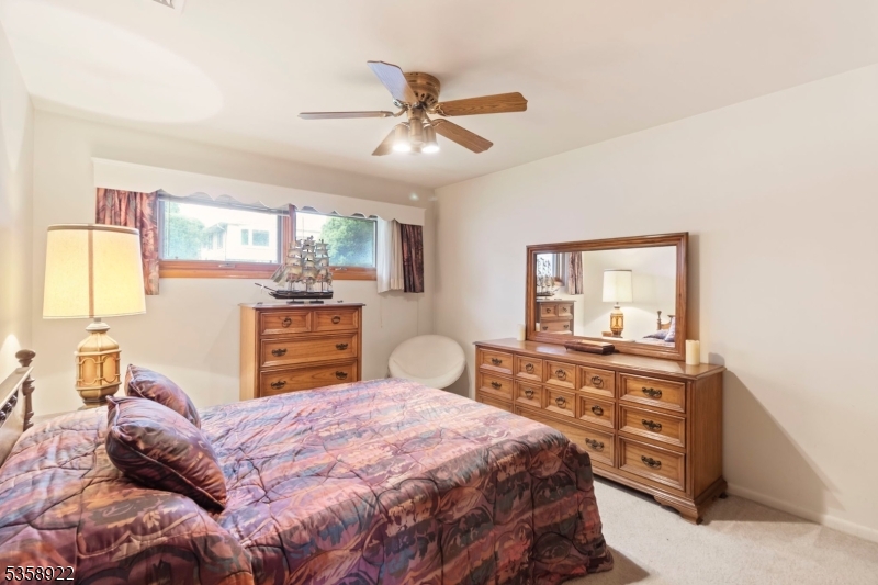 35 Hillside Avenue Netcong, NJ 07857 - Photo 21 of 41 a bedroom with a bed and wooden floor