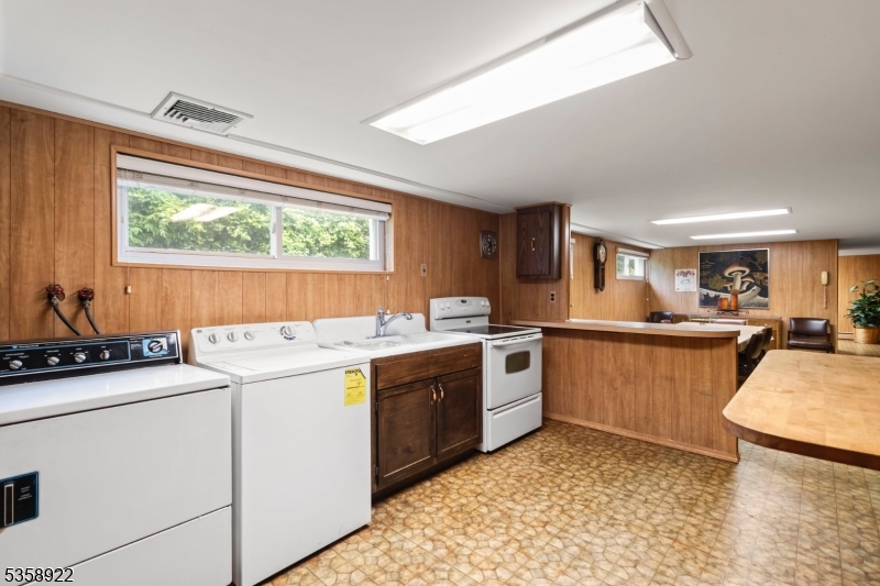 35 Hillside Avenue Netcong, NJ 07857 - Photo 28 of 41 a kitchen with a stove sink and cabinets