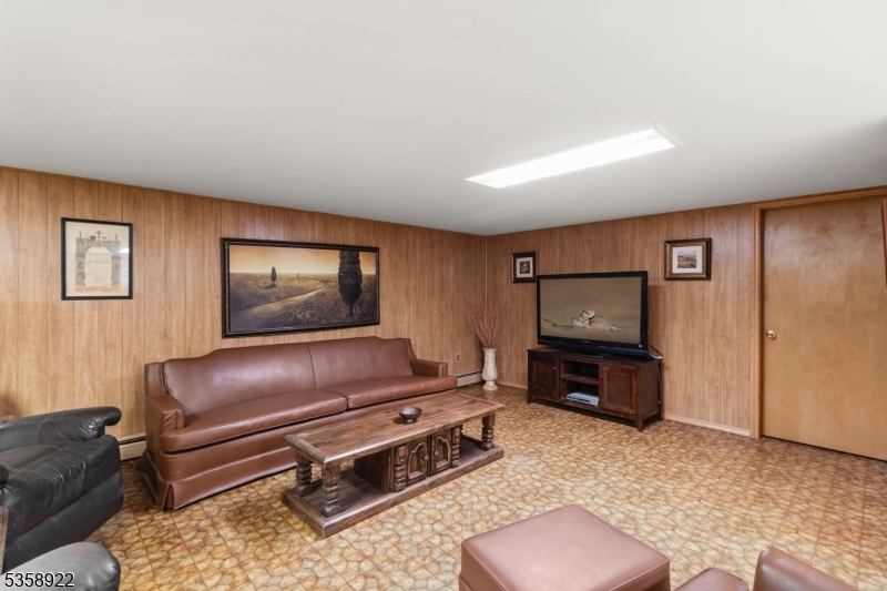 35 Hillside Avenue Netcong, NJ 07857 - Photo 33 of 41 a living room with furniture and a flat screen tv