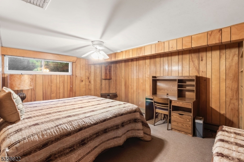 35 Hillside Avenue Netcong, NJ 07857 - Photo 34 of 41 a bedroom with a bed a dresser and a window