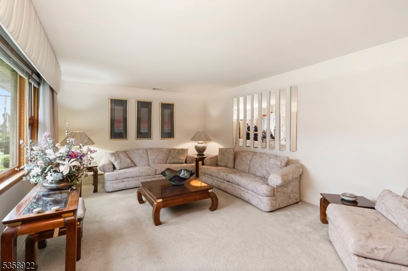 35 Hillside Avenue Netcong, NJ 07857 - Photo 9 of 41 a living room with furniture and flowers