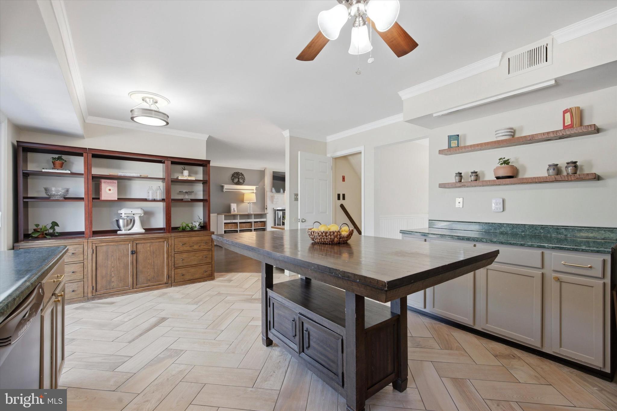 1 Country Village Way Media, PA 19063 - Photo 13 of 50 a kitchen with a wooden floor and cabinets