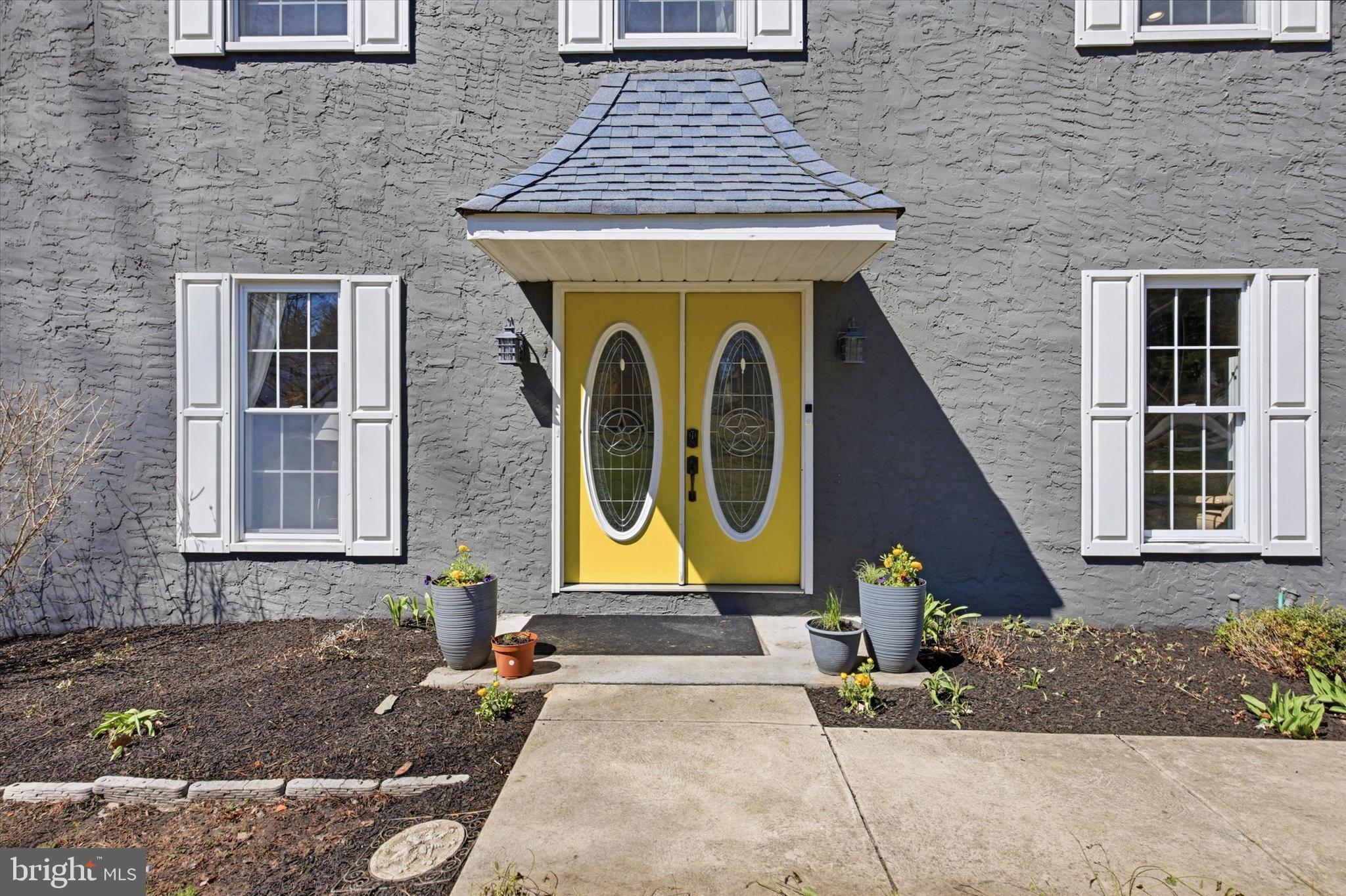 1 Country Village Way Media, PA 19063 - Photo 3 of 50 a front view of a house with garden